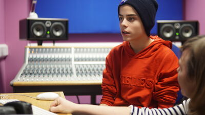 Young boy in recording studio